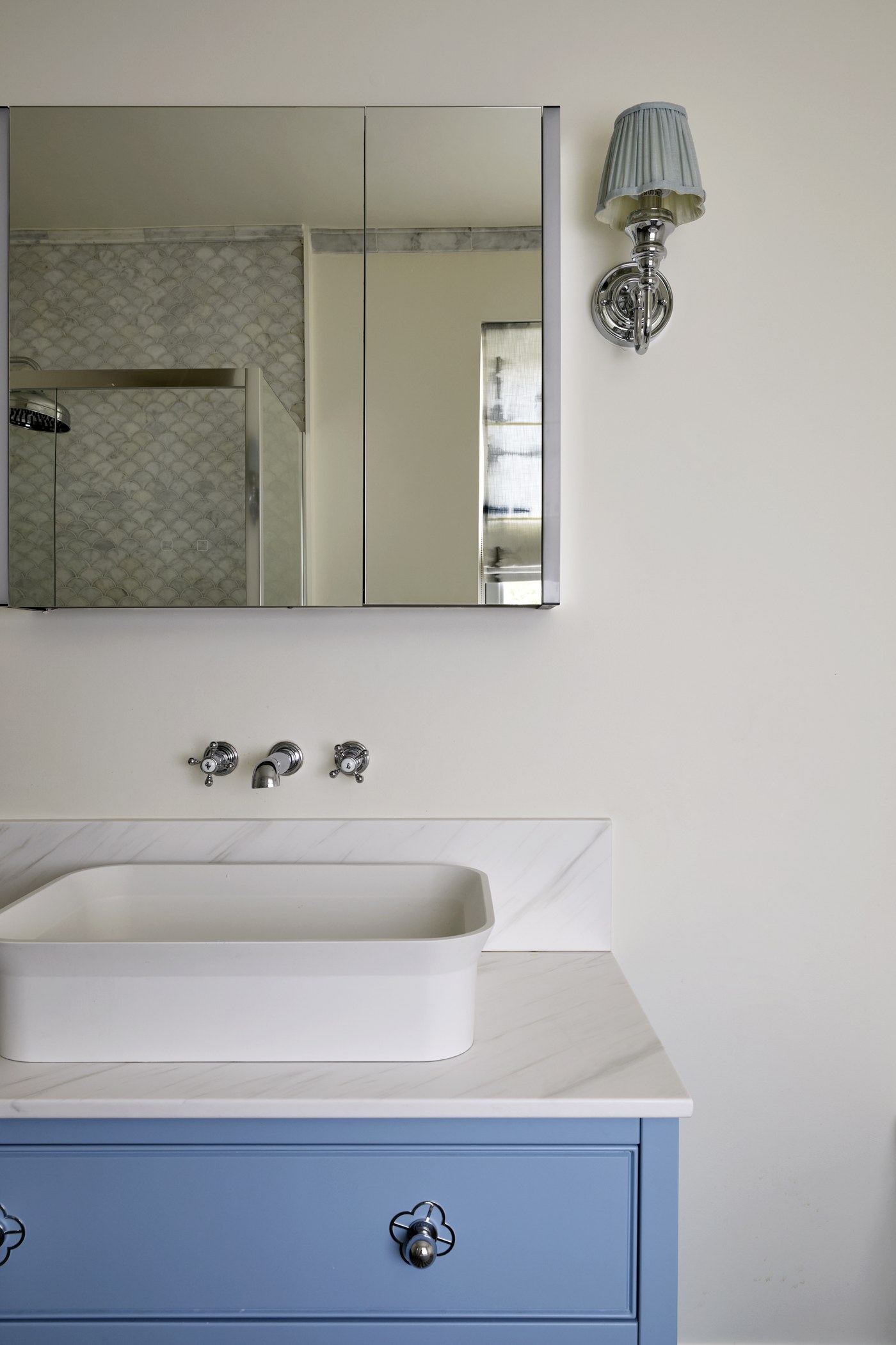 Stone bath surround and wall-mounted taps at Achilles Road