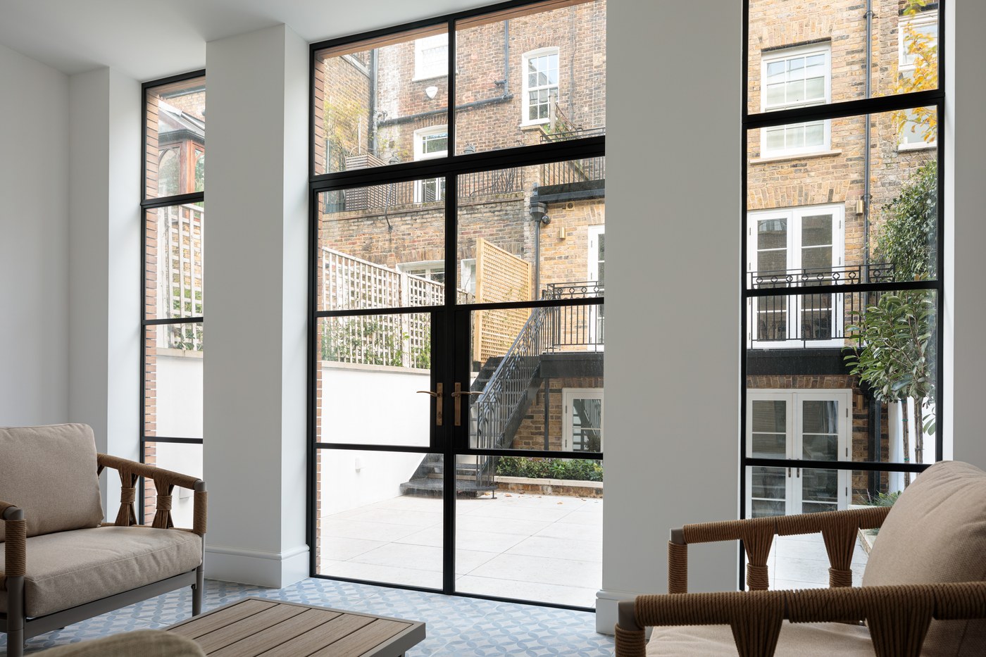 Full-height steel Crittall-style glazing at Brompton Square looking out to the rear courtyard