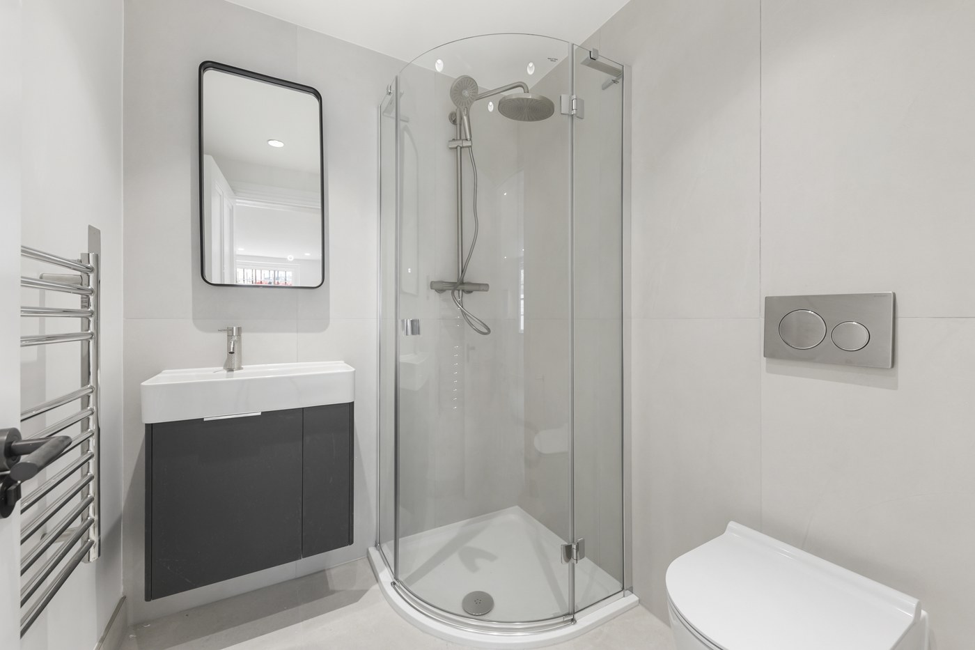 Shower room at Brompton Square with a quadrant enclosure and wall-hung vanity