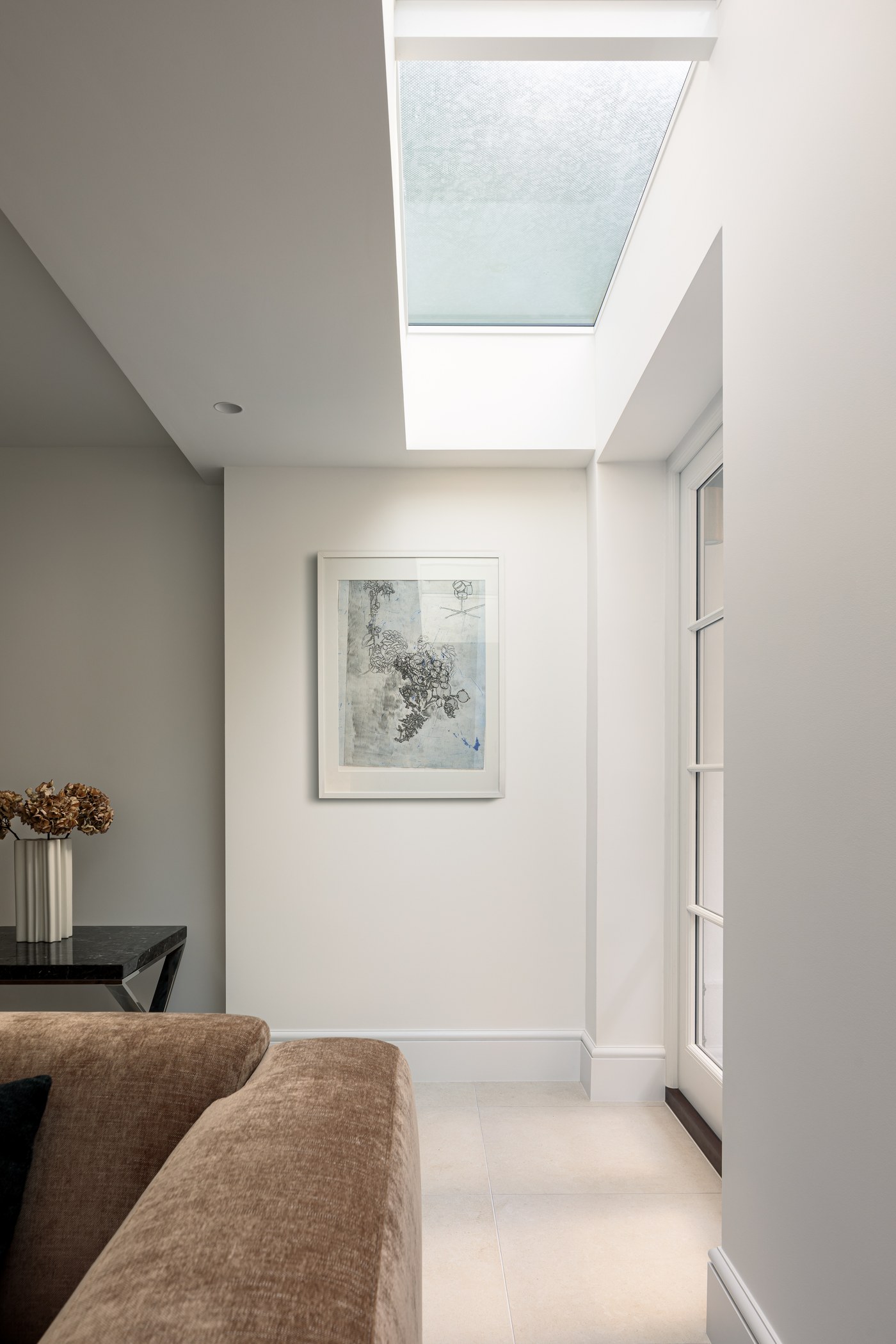 Upper landing at Brompton Square lit from above by a new rooflight