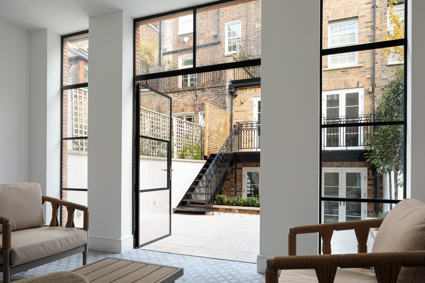 Steel Crittall-style doors opened onto the rear terrace at Brompton Square