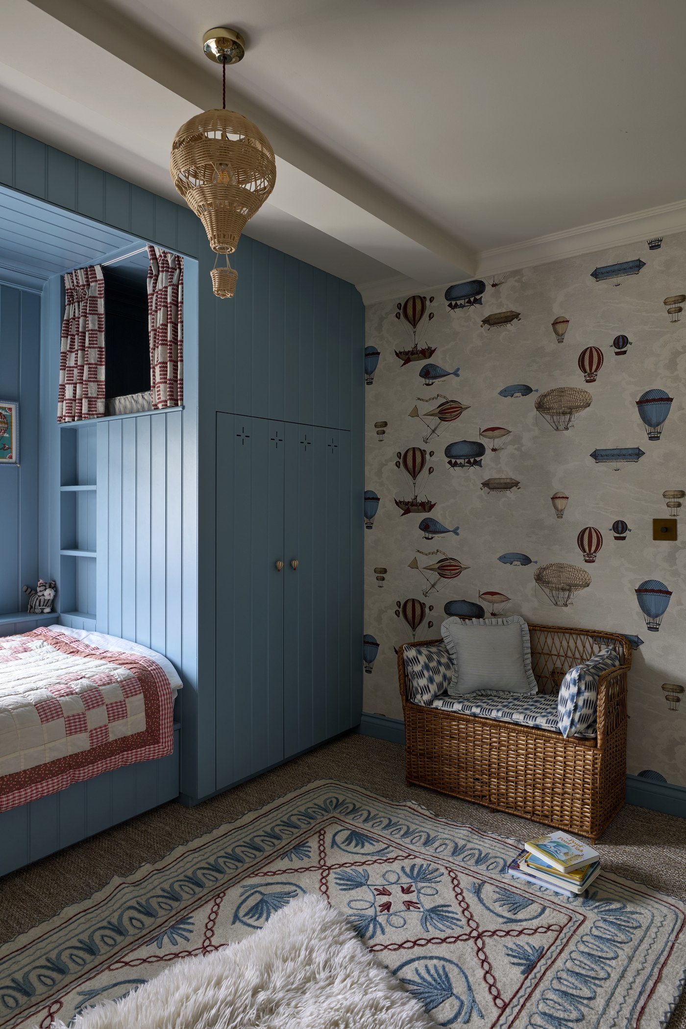 Bedroom at Melrose Gardens with panelled walls, papered above, and a fitted window seat