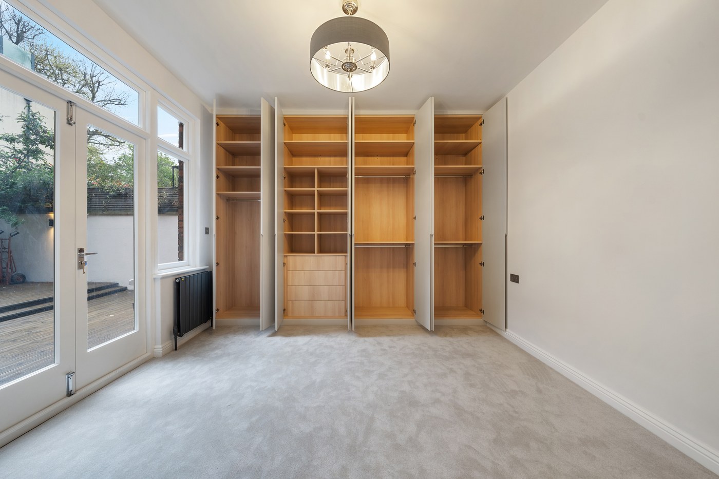Bespoke walk-in wardrobe joinery in timber at St John's Wood Road